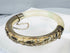 Vintage Chinese bangle with celadon-white stone, green inclusions, and silver mounts