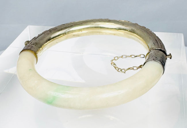 Hinged Chinese jade bracelet with safety chain and decorative silver casing