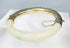 Hinged Chinese jade bracelet with safety chain and decorative silver casing