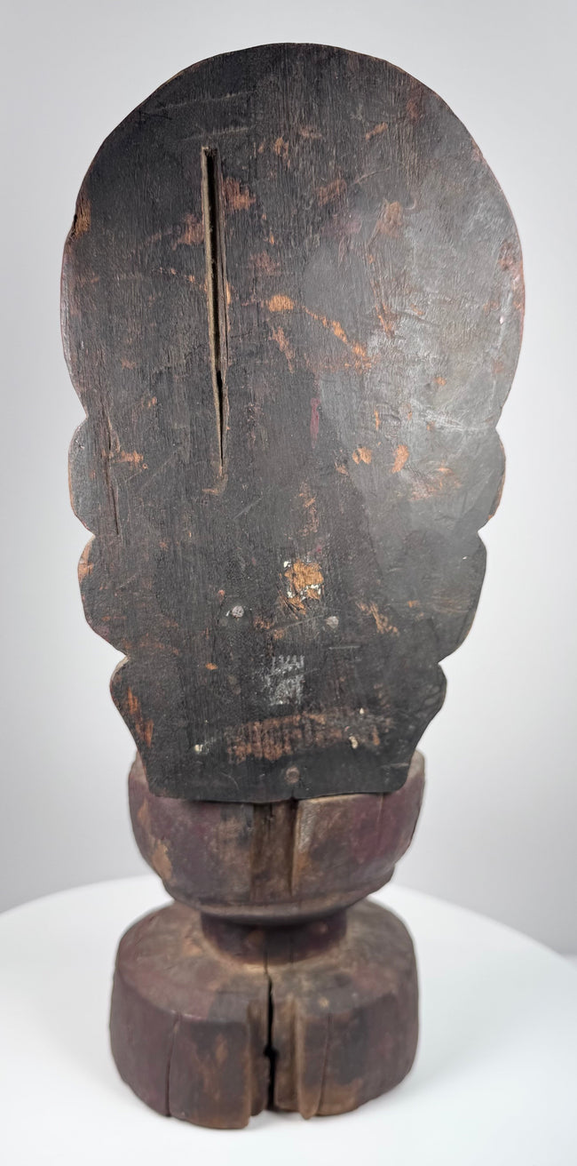 Detail of Guanyin showing serene facial features, crown remnants, traces of gilding and centuries of surface wear