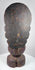 Detail of Guanyin showing serene facial features, crown remnants, traces of gilding and centuries of surface wear