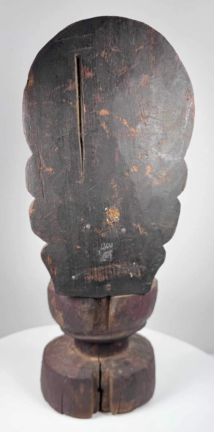 Detail of Guanyin showing serene facial features, crown remnants, traces of gilding and centuries of surface wear