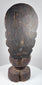Detail of Guanyin showing serene facial features, crown remnants, traces of gilding and centuries of surface wear