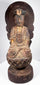Carved wooden Guanyin with serene lowered eyes, weathered gilding and surviving elements of an elaborate crown