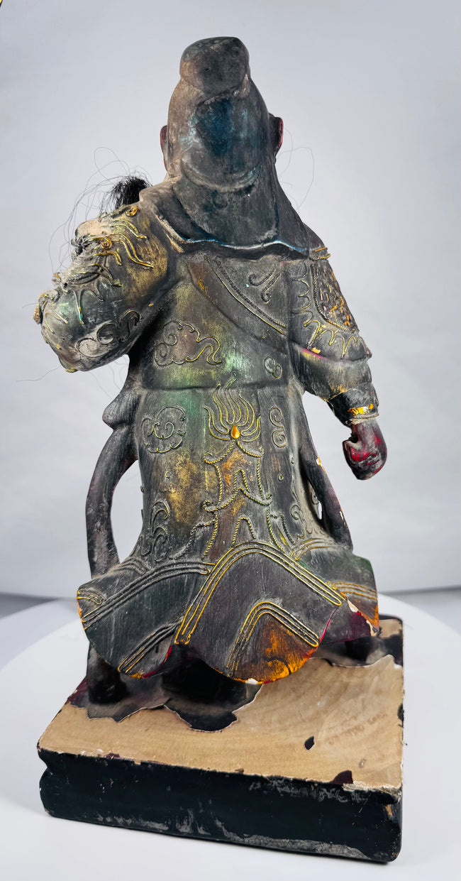 Chinese folk temple statue of Guan Yu standing on an integral rectangular base