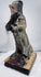 Carved wood Guandi figure with red-painted face, stern expression, and black beard