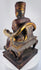 Close-up of Chinese carved wooden official showing dignified facial features, elongated ears and tall square ceremonial cap