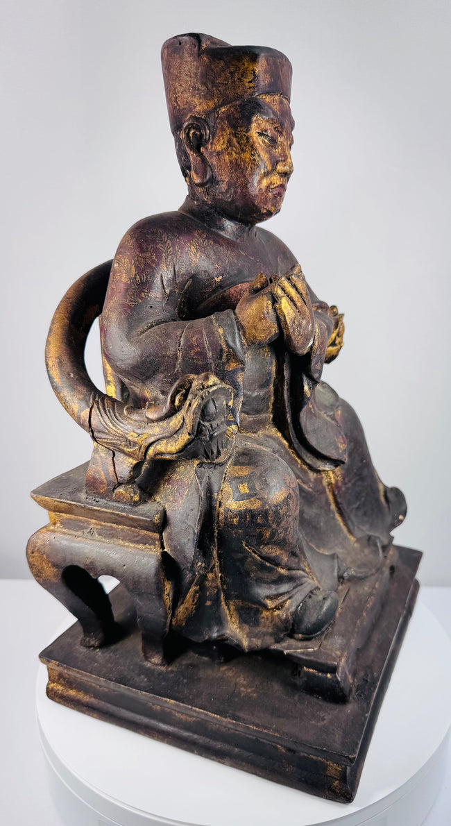 Detail of elaborate Chinese ceremonial throne showing carved hand- or claw-like terminals and decorative arm supports