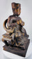 Detail of elaborate Chinese ceremonial throne showing carved hand- or claw-like terminals and decorative arm supports