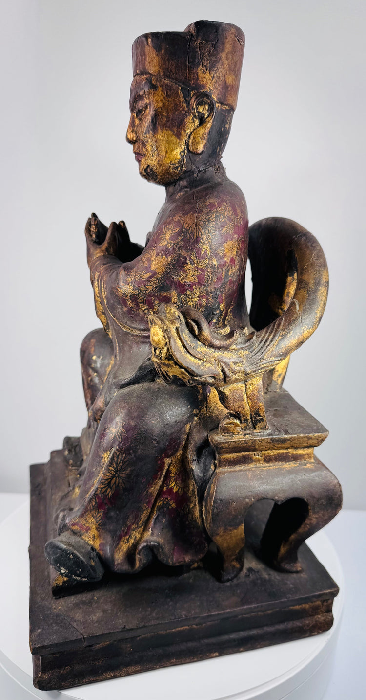 Opposite side view of Qing Dynasty ancestor figure displaying horseshoe-back throne, openwork platform and aged lacquer