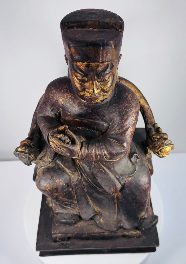 Detail of underside and base of Qing Dynasty wooden figure showing reinforcement blocks, old repairs and age-related cracking