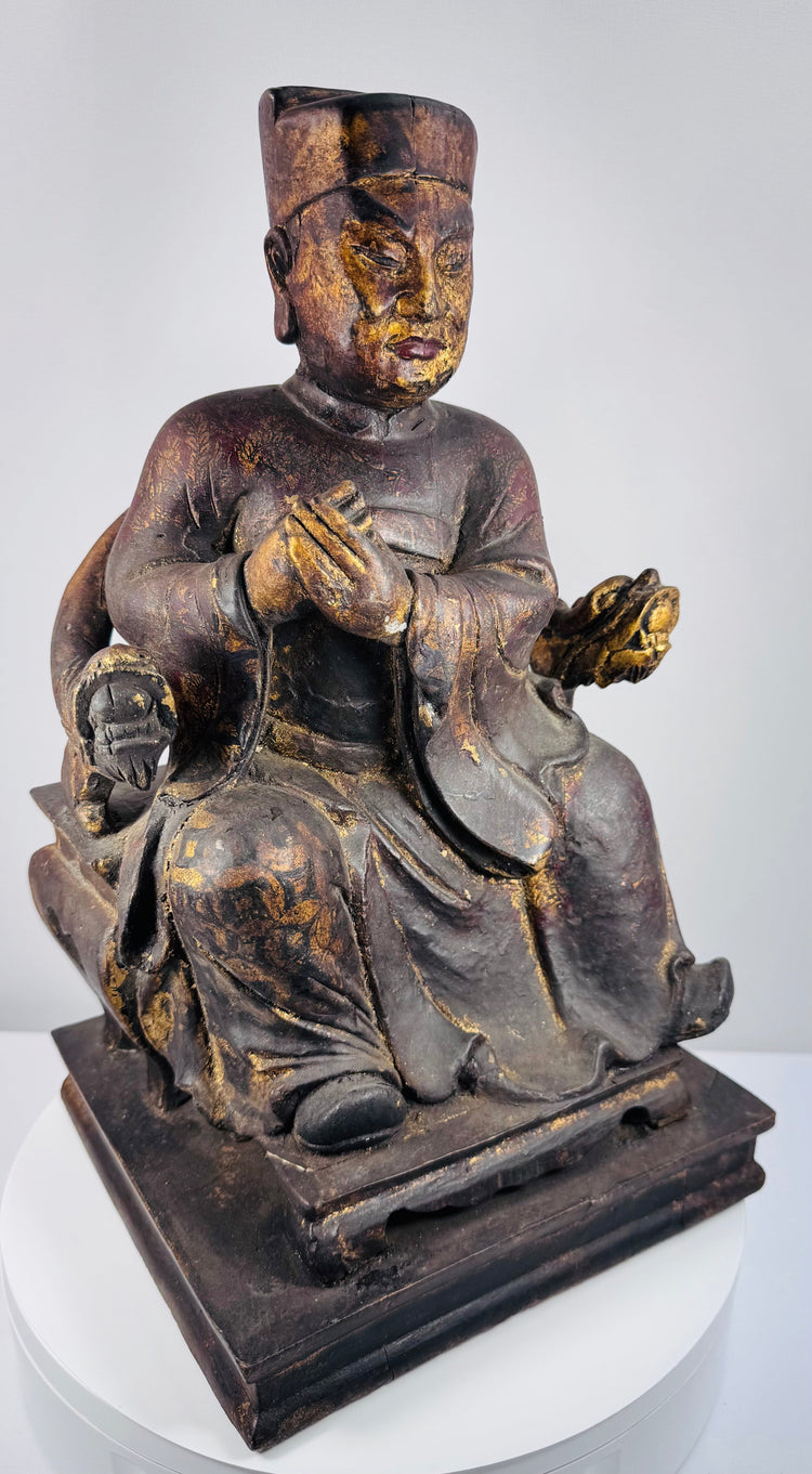 Lower view of Chinese carved wood dignitary showing openwork chair platform, stepped plinth and historic repairs