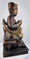 Rear view of antique Chinese Qing Dynasty wooden ancestor figure showing carved throne construction and aged surface
