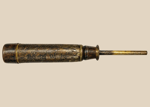 Antique Chinese temple candle holder from the Late Qing Dynasty (circa 1850–1911), cylindrical bronze form with engraved Chinese inscriptions and decorative motifs, mounted on a tapered base; patinated surface with signs of ritual use, once employed in Buddhist or Daoist temple settings as part of ceremonial altar furnishings.