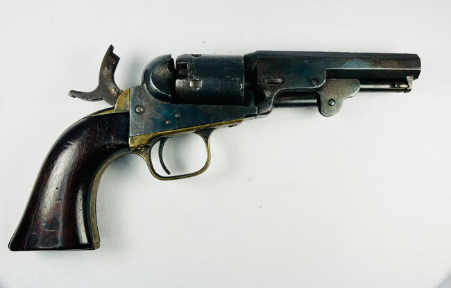 Antique Colt Model 1849 .31 caliber percussion revolver with octagonal barrel and stagecoach robbery engraving