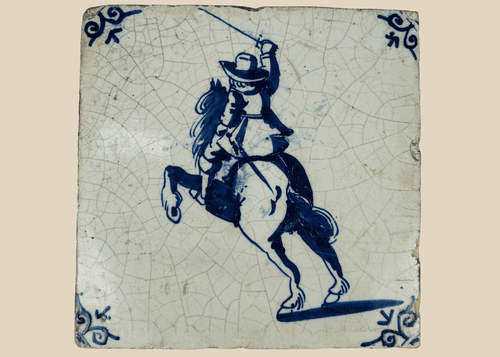 antique Dutch Delft tile with mounted swordsman on rearing horse