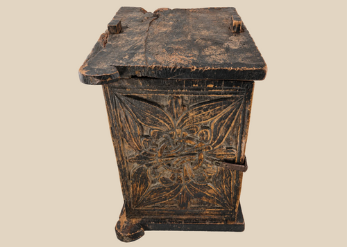 Antique South Asian carved wooden chest with floral panel and iron latc