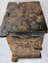 Antique carved wooden cabinet opened to reveal its deep storage compartment