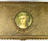 Textured gold sheet with wavy engraved patterns displayed against a white background.