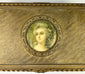 Textured gold sheet with wavy engraved patterns displayed against a white background.