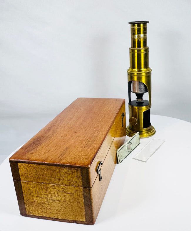 French-style nineteenth century brass microscope with original specimen slides and storage case