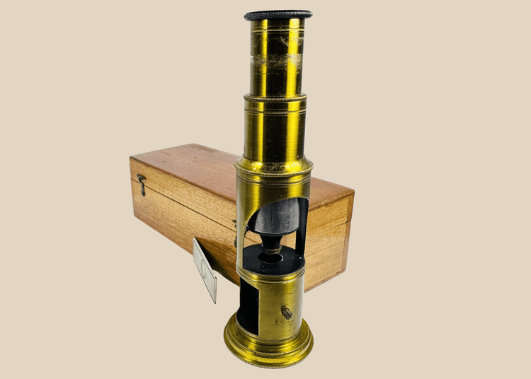 Antique French-style brass drum microscope with original hardwood carrying case and period specimen slides