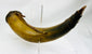 Authentic 1700s–1800s powder horn showing warm horn coloration and period wear
