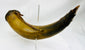 Authentic 1700s–1800s powder horn showing warm horn coloration and period wear