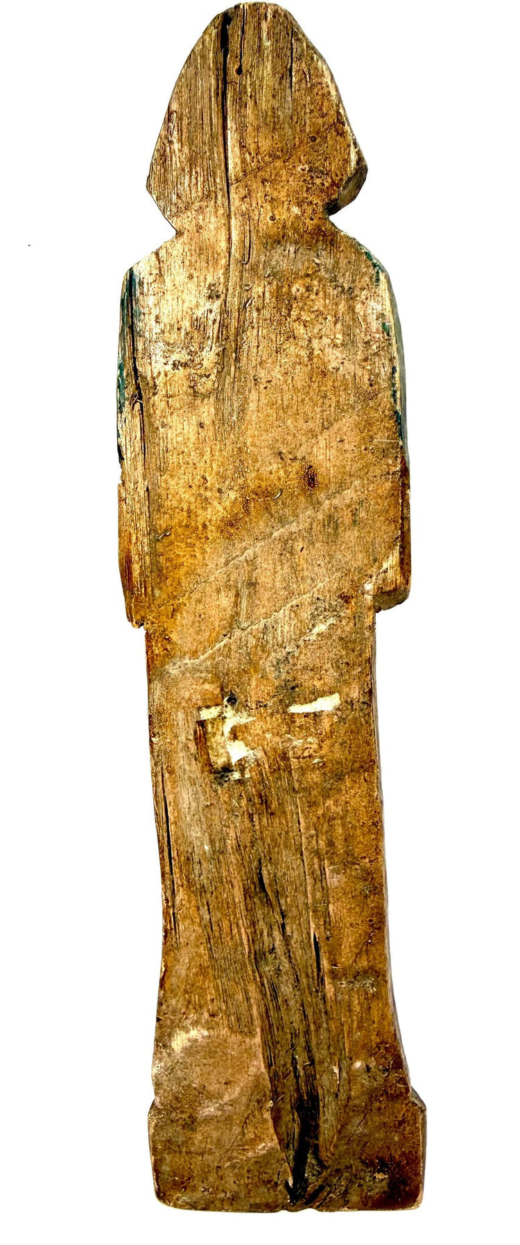 Antique hand-carved wooden figurine back view with green pigment traces and wood grain