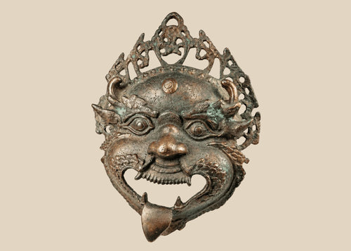 Antique Himalayan bronze Mahakala ritual mask with filigree crown and green patina