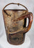 Traditional Tibetan or Nepalese hardwood container featuring hand-carved decorative bands