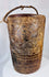 Himalayan folk art vessel featuring deep relief carving and sculptural carrying handle