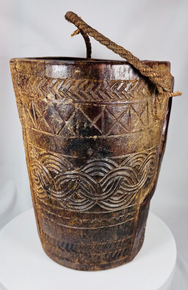 Carved hardwood dairy or provision vessel from Tibet or Nepal with original rope handle