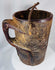 Hand-carved Himalayan wooden vessel with integrated handle and fiber suspension cord