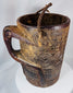 Hand-carved Himalayan wooden vessel with integrated handle and fiber suspension cord