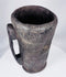 Rustic Tibetan carved hardwood container with integral handle and aged utilitarian surface