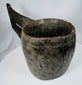 Himalayan carved hardwood vessel displaying primitive craftsmanship and decorative border motifs