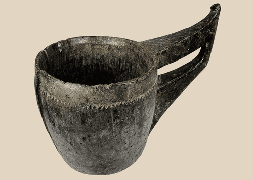 Antique Himalayan hand-carved wooden ceremonial vessel with elongated sculptural handle