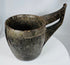 Ethnographic hardwood vessel with carved triangular motifs and integrated handle construction