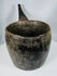 Antique wooden ritual container from the Himalayan region with extensive age-related wear