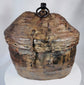 Himalayan provisions container featuring coiled basketry construction and leather exterior