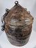 Rare woven reed and hide travel basket displaying traditional indigenous craftsmanship