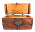 Antique wooden travel chest with original wrought iron fittings, visible craftsmanship, and naturally aged surface texture.