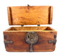 Antique wooden travel chest with original wrought iron fittings, visible craftsmanship, and naturally aged surface texture.