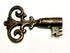 Close-up of ornate hand-forged iron skeleton key with intricate scrollwork bow and bitted end