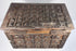 Top angle of a late 19th-century Indian hardwood box with brass cladding, showing the raised pyramid-grid decoration across the lid, original hinges, and patterned front panel.