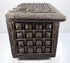 Angled exterior of an antique Indian lidded box highlighting the brass-covered lid, patterned front panels, and hardwood construction.