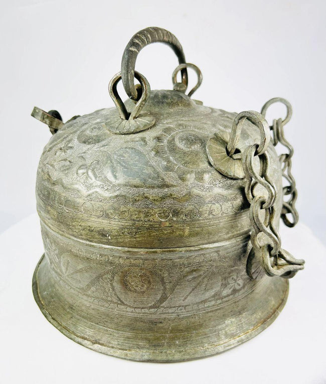 Antique Indian copper Paan Daan (betel box) with domed lid, swing handle, decorative chains, and locking clasp, late 18th–early 19th century.