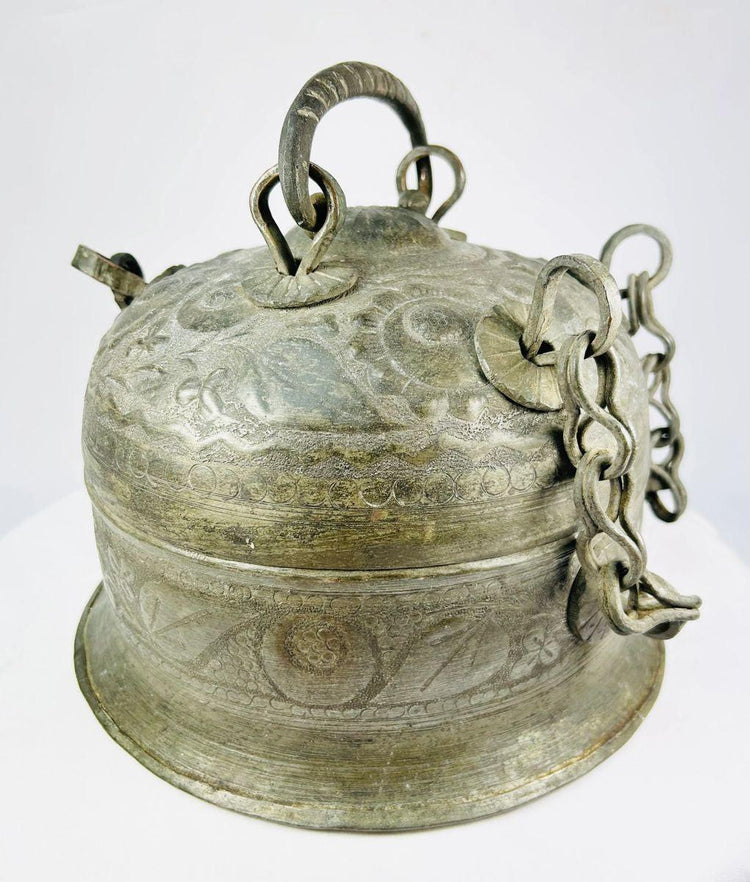 Antique Indian copper Paan Daan (betel box) with domed lid, swing handle, decorative chains, and locking clasp, late 18th–early 19th century.