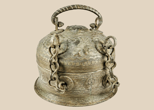 Antique Indian copper Paan Daan (betel box) with domed lid, swing handle, decorative chains, and locking clasp, late 18th–early 19th century.